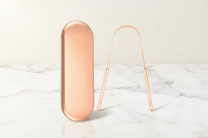 Auralis tongue scraper designed for effective tongue cleaning and breath freshening, featuring a sleek rose gold finish.